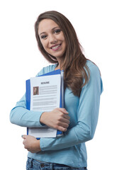 Young woman holding her resume