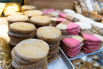 Variety of cookies with sugar on bakery window display. Classic Mexican street kiosk sweet pastry