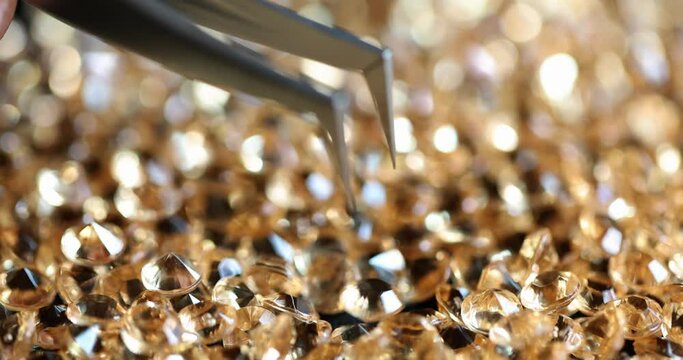 Lots of natural yellow diamonds and gemology tweezers