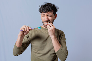 People holding toothbrush with gum pain. Man holding toothbrush with gum pain, People holding...