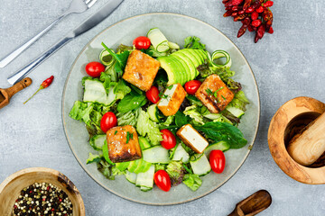Salad of roasted tofu and fresh vegetables, top view