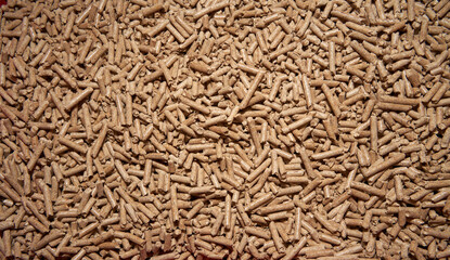 Flatlay of wood pellet. Macro shot of renewable and sustainable fuel. Pellet 6mm rolls is a byproduct of the wood industry