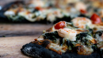 Close up charcoal pizza in the cafe