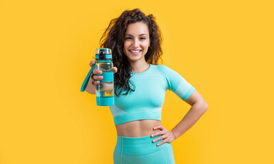 fitness woman with sport water bottle, selective focus. fitness woman hold sport water bottle