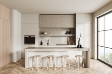 Stylish kitchen interior with bar countertop, kitchenware and panoramic window