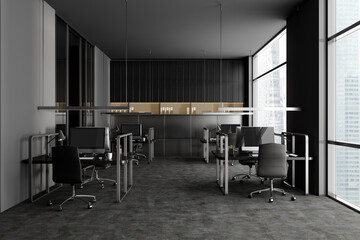 Grey workspace interior with pc computers, panoramic window on city view