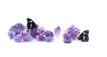 butterflies, Amethyst minerals set and flowers on white background. quartz gemstones for...