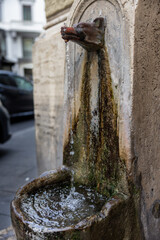 Wolf head public water fountain, Rome, Italy