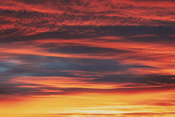 Abstract Saturated Orange-yellow Colors Of Clouds. Unusual Sky Background. Rich Orange Colors. Toned Pink-yellow Clouds. Sky Sunset Sunrise Background. Cloudy Sky. Sunny Cloudscape.