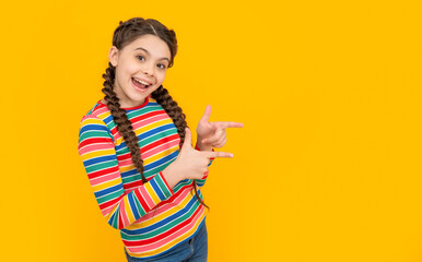 teen girl with braids on hair in studio with copy space. photo of teen girl having braids.