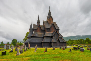 Fototapeta na wymiar Stave Church in Heddal - a stave church located in the Norwegian town of Heddal, in the municipality of Notodden, in the Telemark region. It is the largest of 28 churches of this type in Norway