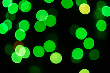 Christmas defocused lights, blurred colorful lights on a dark background, festive background