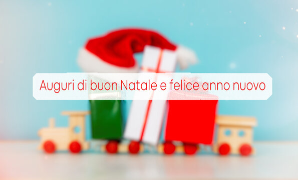 Merry Christmas and happy New Year in italian holidays card, presents box and gift in  color of Italian flag blurred background