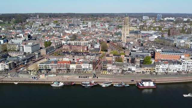 Aerial view of Arnhem cityscape showing typical Dutch architecture and buildings blue sky horizon in background of city in Gelderland east of the Netherlands blue sky 4k high resolution footage