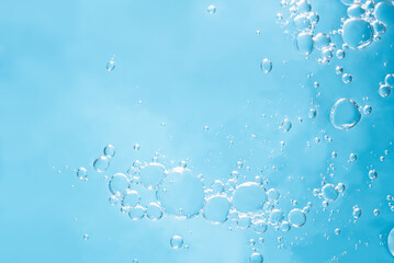 Close up macro Aloe vera gel serum cosmetic texture blue background with bubbles. Cruelty free. Lemongrass gel skincare product. antibacterial liquid with aloe vera, moisturizing.