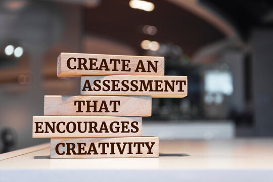 Wooden blocks with words 'CREATE AN ASSESSMENT THAT ENCOURAGES CREATIVITY'.