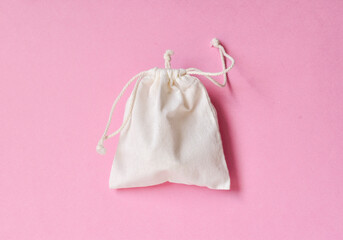 White tote bag on pink background, global warming concept
