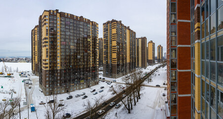 View of the residential area of the city and the Neva River from the top floor of a high-rise building.