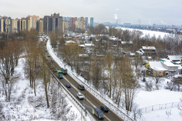 View of the residential area of the city and the Neva River from the top floor of a high-rise building.