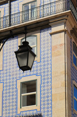 Typical facade of Lisbon, with a lantern in the foreground
