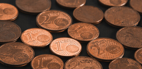 Euro cent coins on table close up. Abstract background from coins. Soft focus