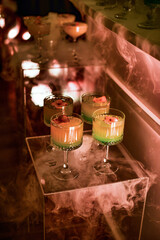 The buffet at the reception. Assortment of cocktails Banquet service. catering festive food and drink