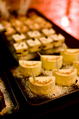 The buffet at the reception. Assortment of cupcakes on table Banquet service. catering festive food