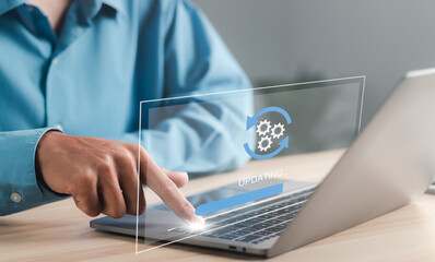 Businessman working and Installing update process. Software update or operating system upgrade to keep the device up to date with added functionality in new version and improve security.