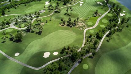 Aerial view of green golf course and putting green, Aerial view of green grass and coconut palm...