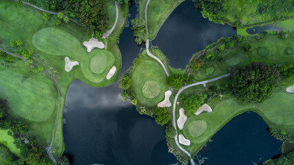Aerial view of green golf course and putting green, Aerial view of green grass and coconut palm...