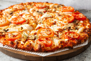 pizza with salami and tomatoes