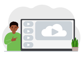 A little boy looks at the huge screen of a TV device, tablet or computer. The concept of a children's show or educational channel.