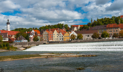 Obraz premium River view on Landberg-am-Lech town, Germany on a cloudy autumn day