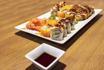 Sushi rolls of salmon and other fish on the table