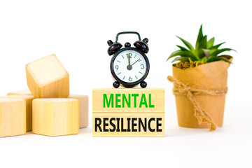 Mental resilience symbol. Concept word Mental resilience on wooden blocks. Beautiful white table...