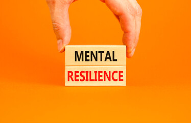 Mental resilience symbol. Concept word Mental resilience typed on wooden blocks. Beautiful orange...