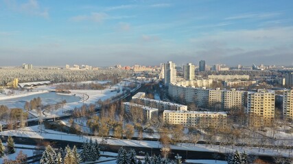 Vostok microdistrict in Minsk in winter. Sleeping areas of the capital of Belarus in the snow. Snow-covered Minsk in winter. Aerial photography of Minsk from above. Eastern Europe.