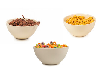 Chocolate corn flakes falling to the white bowl isolated on white. Motion.