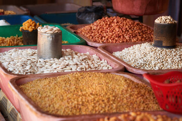 Madagascar street market, various legumes in bowls, Madagascar food.