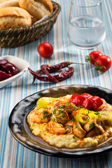 Shrimps with Beğendi sauce on a bowl