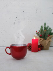 panetonne with tea and Christmas decoration on concrete background.
