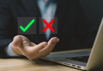 Businessman hand showing plus and minus symbols.	
