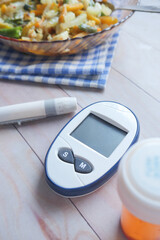 vertical shot of diabetic measurement tools and healthy food on table 