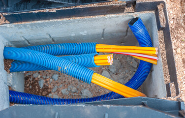Pvc conduit for fibre optic cables in an open concrete shaft in the street for the construction of...