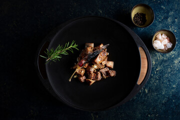 Traditional spicy liver in black pan, Arnavut Ciğeri