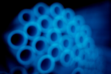 Background of the blue plastic pipes in stacked