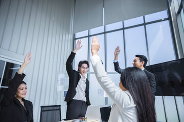Business group of people raise hands celebrate business success with graphic chart, Teamwork concept