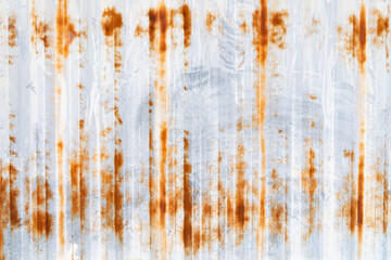 Old rusty zinc sheet wall. Galvanized metal corrosion. Texture and background in retro concept.