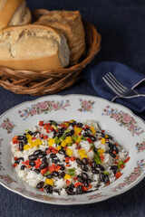Gallo pinto, traditional Nicaraguan food on blue tablecloth.