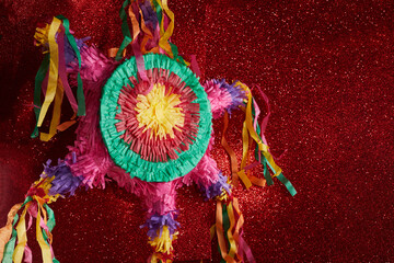 Mexican Pinata used in posadas and birthdays on red background - obrazy, fototapety, plakaty